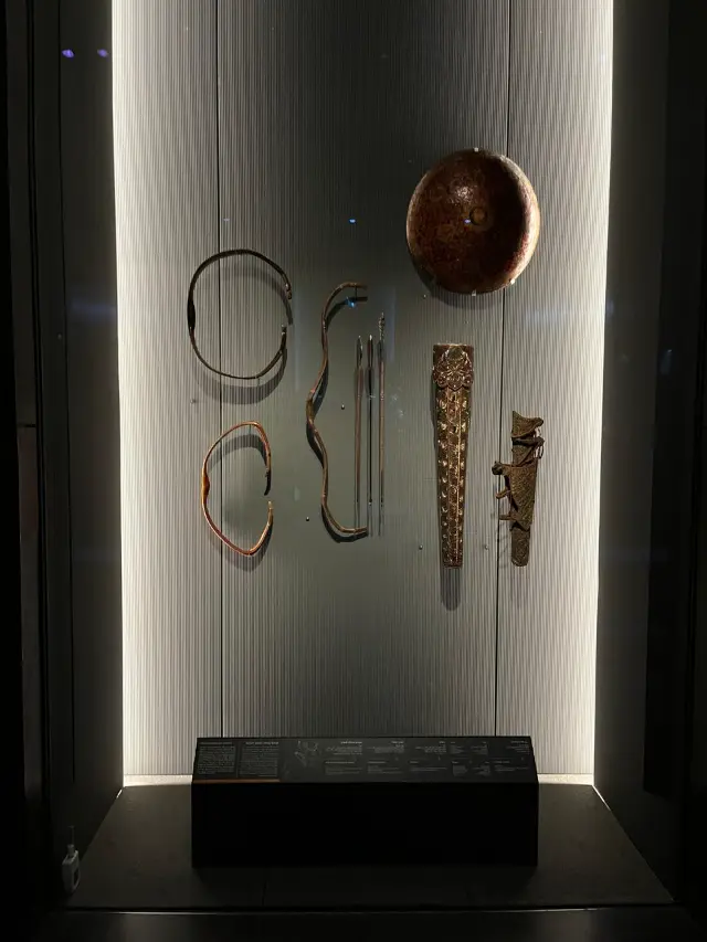 Historic bows and a shield on display at the Museum of Islamic Art